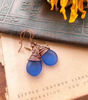 Blue frosted teardrop Czech glass and copper wire wrapped earrings.