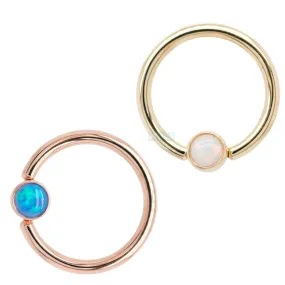 Captive Bead Ring (CBR) in Gold with Bezel-set Red Opal Captive Bead