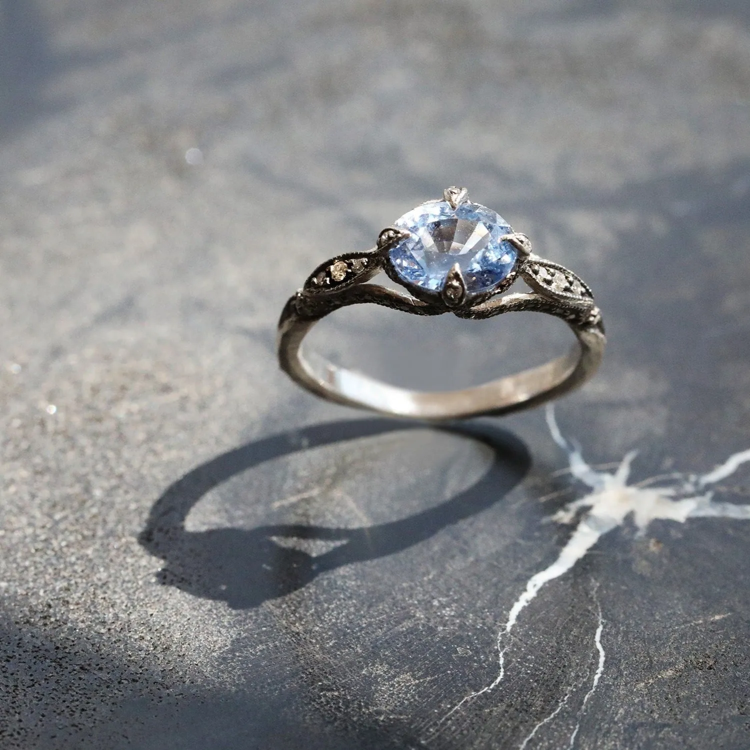 Platinum and Blue Sapphire Petal Side Ring